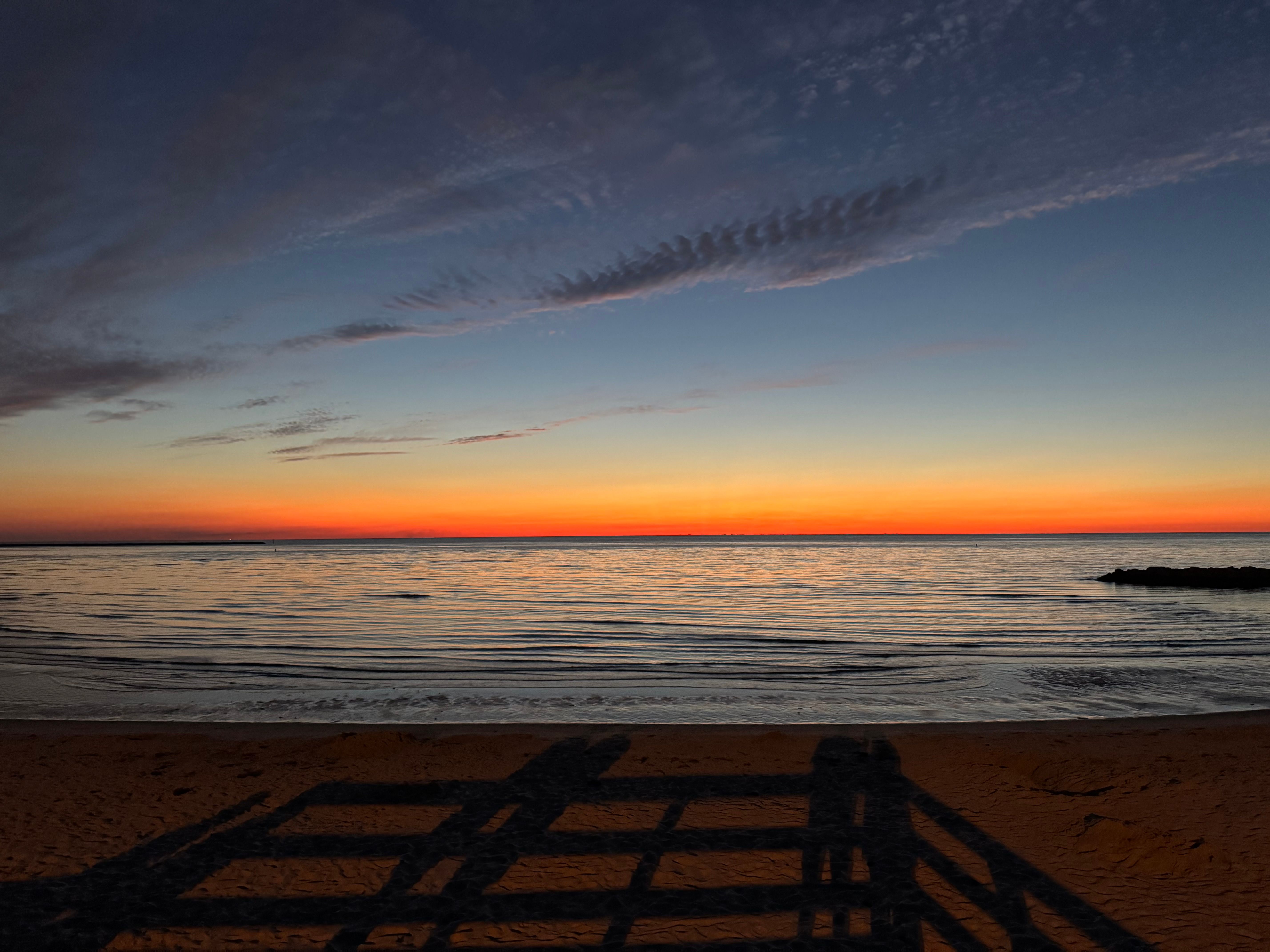 Classic sailboats on the broad waters of the Chesapeake Bay at sunset