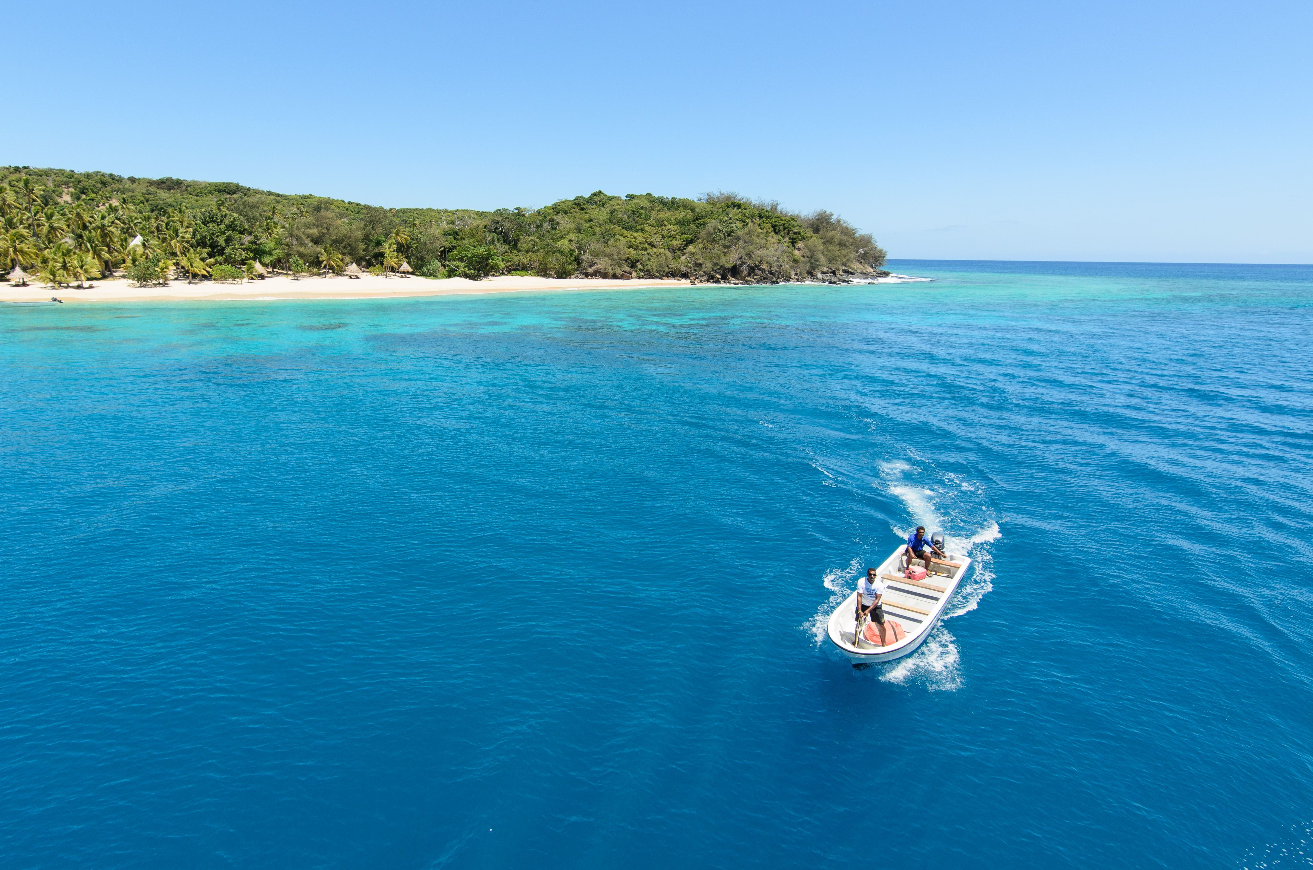 Turquoise lagoon and lush tropical island in Fiji