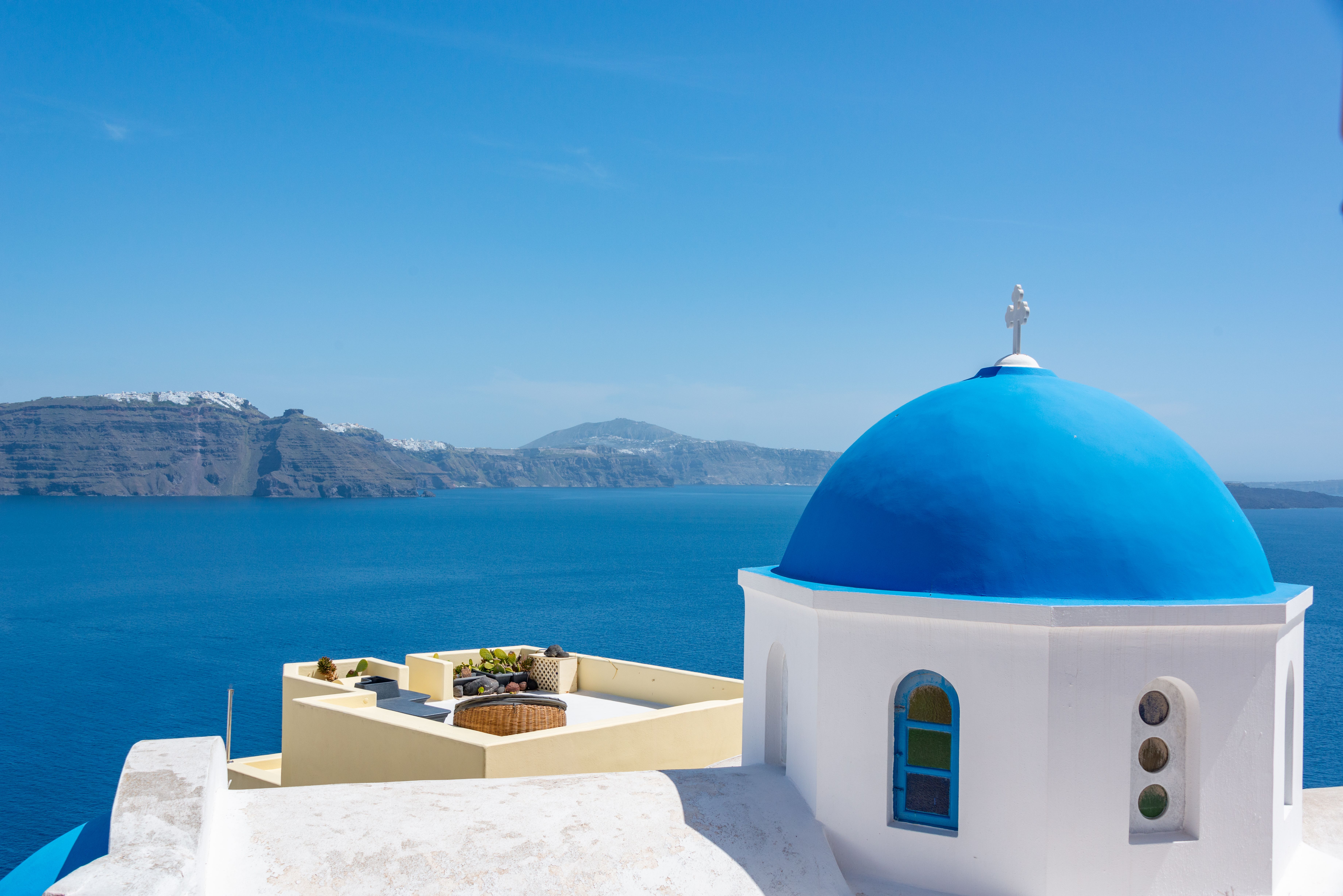 Iconic whitewashed buildings and turquoise waters of the Greek islands