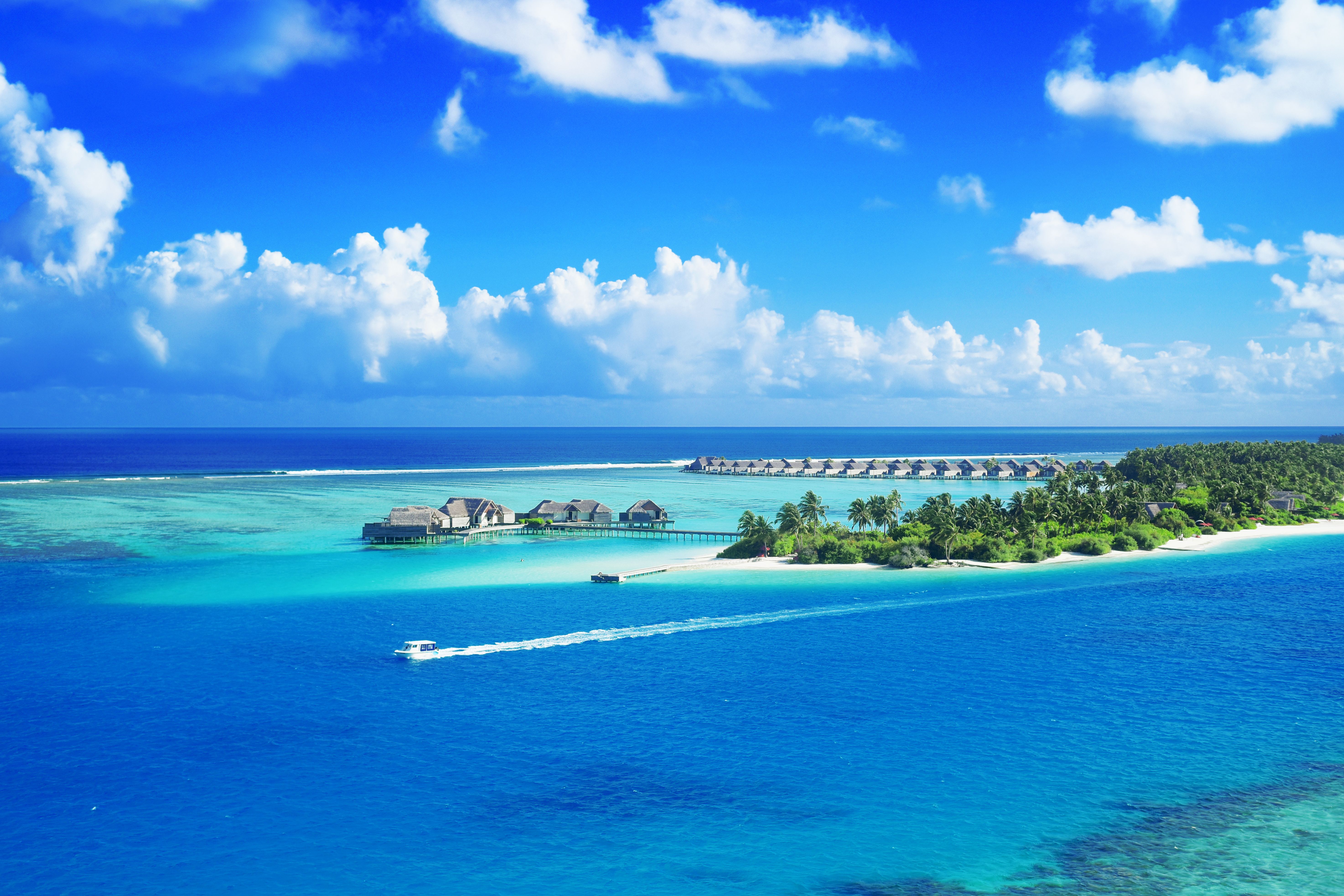 Crystal-clear turquoise atolls and pristine coral reefs of the Maldives